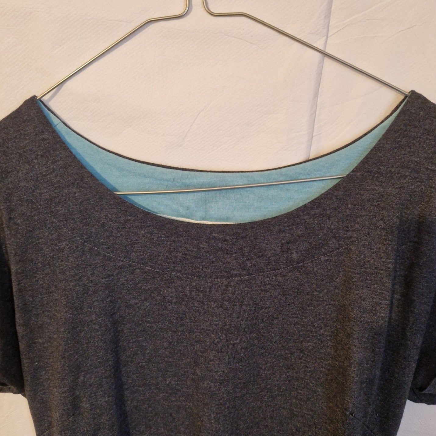 A grey Weird Fish midi shift dress with a round neckline and a light blue inner lining.